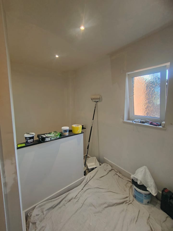 Upper hallway area being redecorated with full floor protection in place