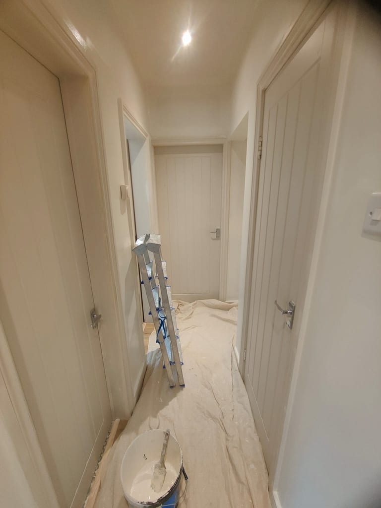 Hallway colour drench and restored woodwork completed by JC Decorators