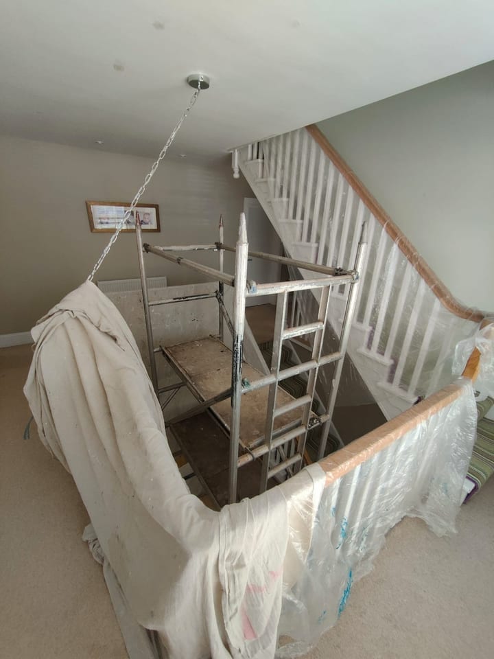 Multi-level residential staircase before the decorating refresh